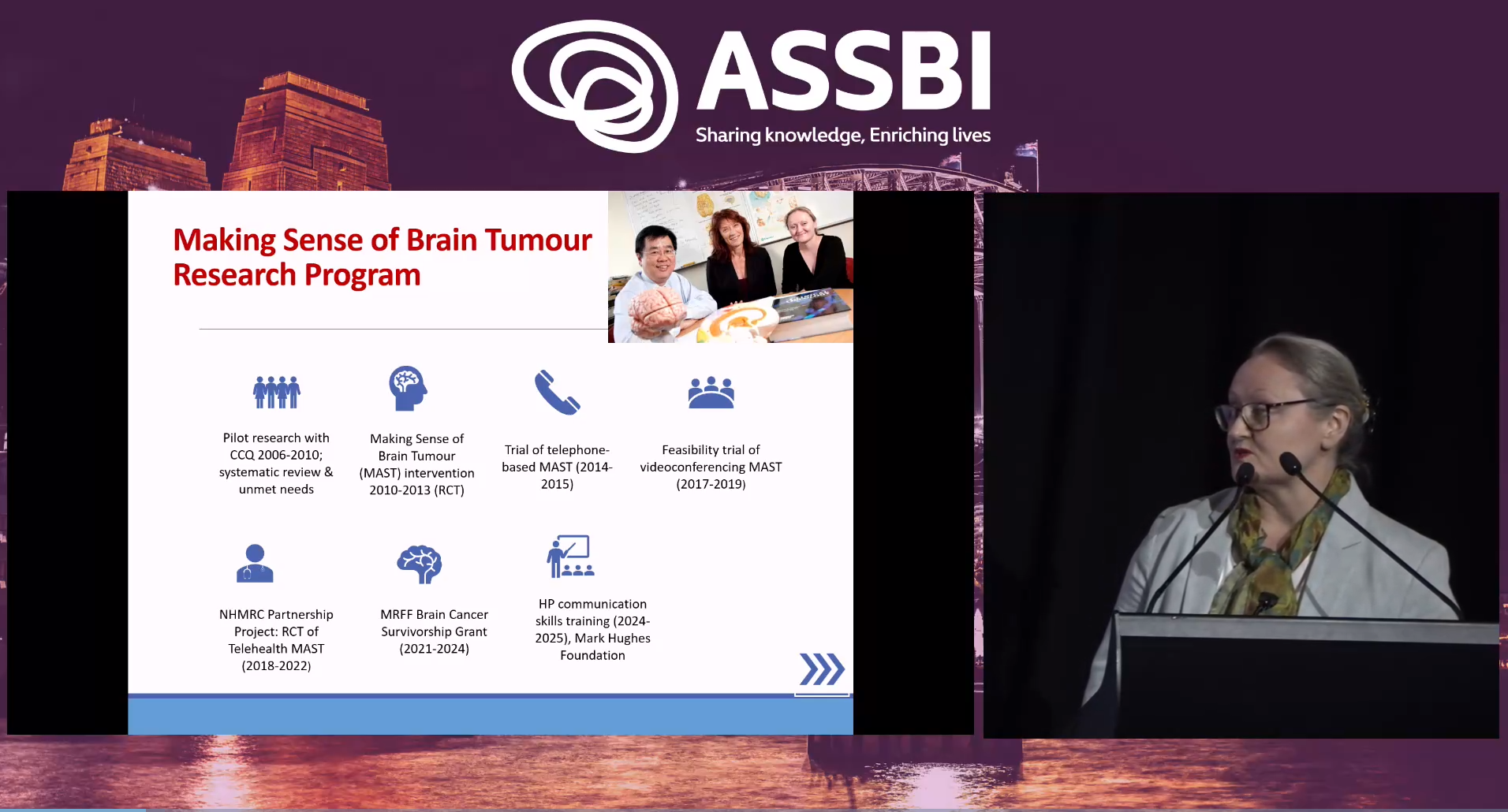 An inserted photo grab of Tamara Ownsworth as she is presenting at ASSBI, on a black background, to the right hand side. To the left is a slide from Tamara's presentation. The background is purple with the ASSBI logo in white at the top. 
