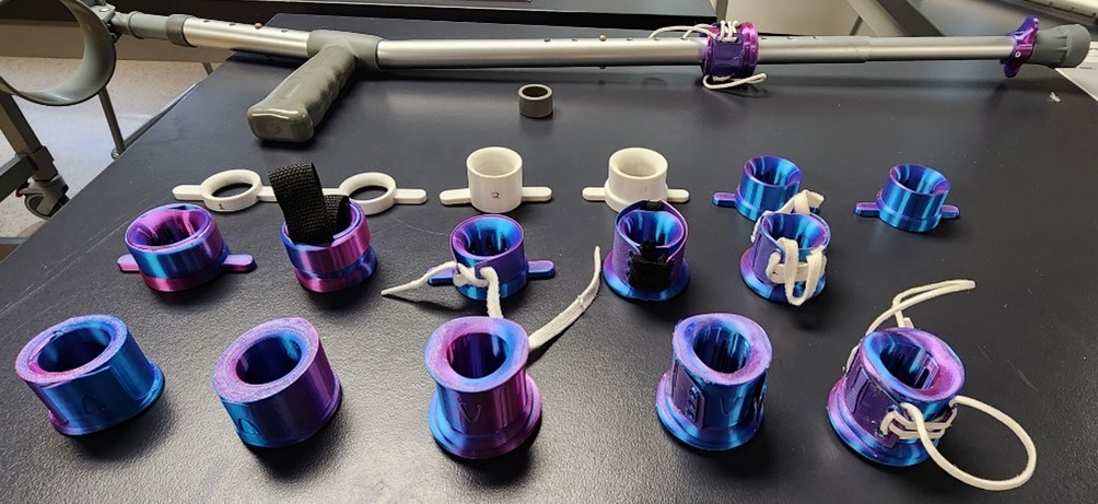 Purple metallic cylinders, arranged on a table top